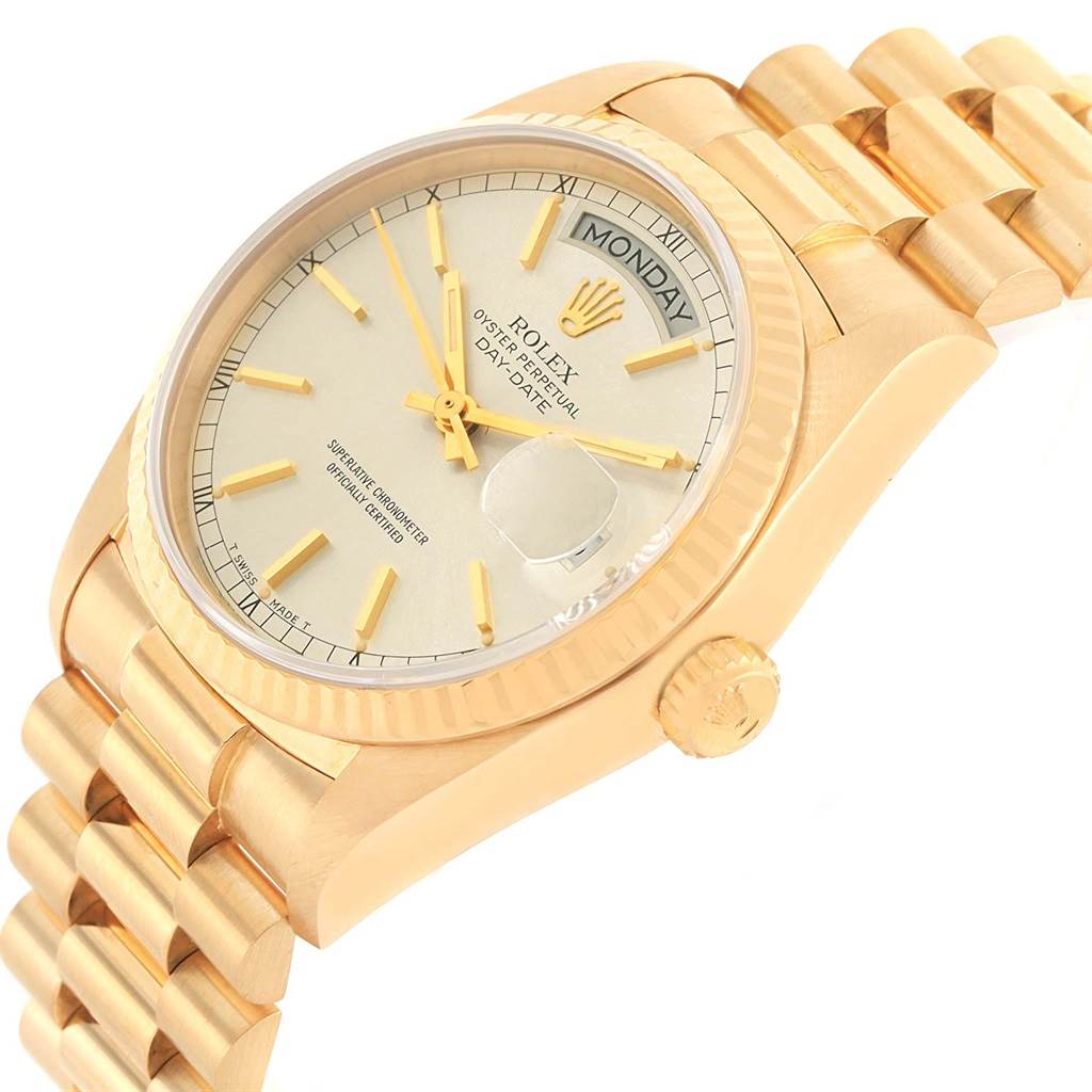 This image shows a side angle of the Rolex President 18038 Men
s Yellow Gold Silver Dial 18038 Men
s Yellow Gold Silver Dial Day-Date watch, highlighting the crown, bracelet, and face with the day display.