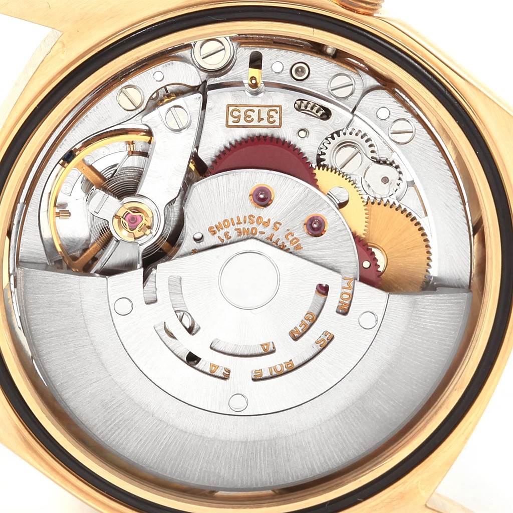 The image shows the intricate internal mechanism of a Rolex President 16238 Men
s Yellow Gold Champagne Dial 16238 Men
s Yellow Gold Champagne Dial model watch from a close-up, rear angle.