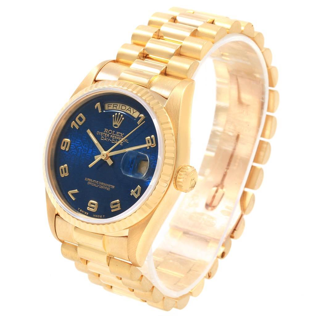 The Rolex President 18038 Men
s Yellow Gold Blue Dial 18038 Men
s Yellow Gold Blue Dial model watch is shown at a three-quarter angle, highlighting the gold bracelet, blue dial, and day-date display.