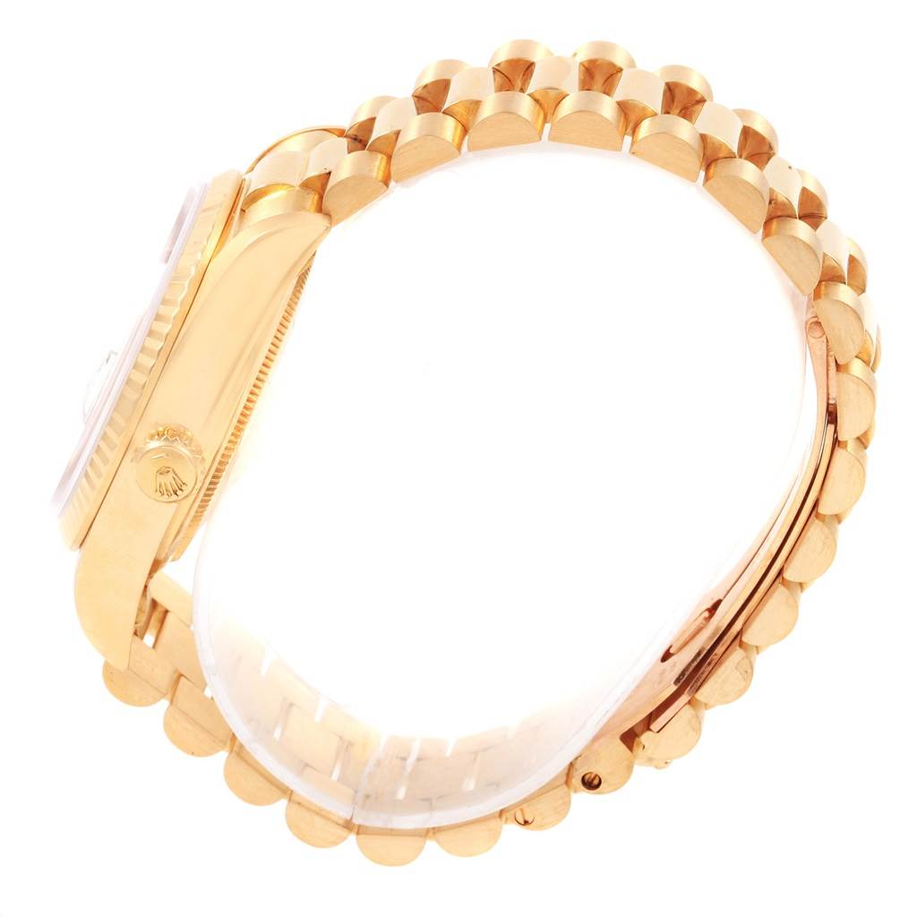 The image shows a side view of the Rolex President 18038 Men
s Yellow Gold Blue Dial 18038 Men
s Yellow Gold Blue Dial model watch, highlighting its gold case, crown, and bracelet.