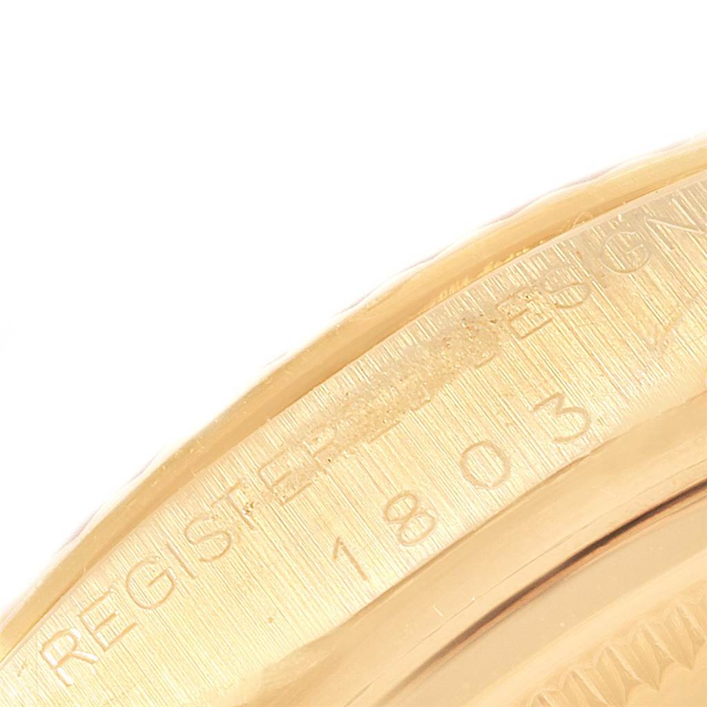 This close-up image of a Rolex President 1803 Men
s Yellow Gold Black Dial 1803 Men
s Yellow Gold Black Dial model shows the engraved details on the watch case.