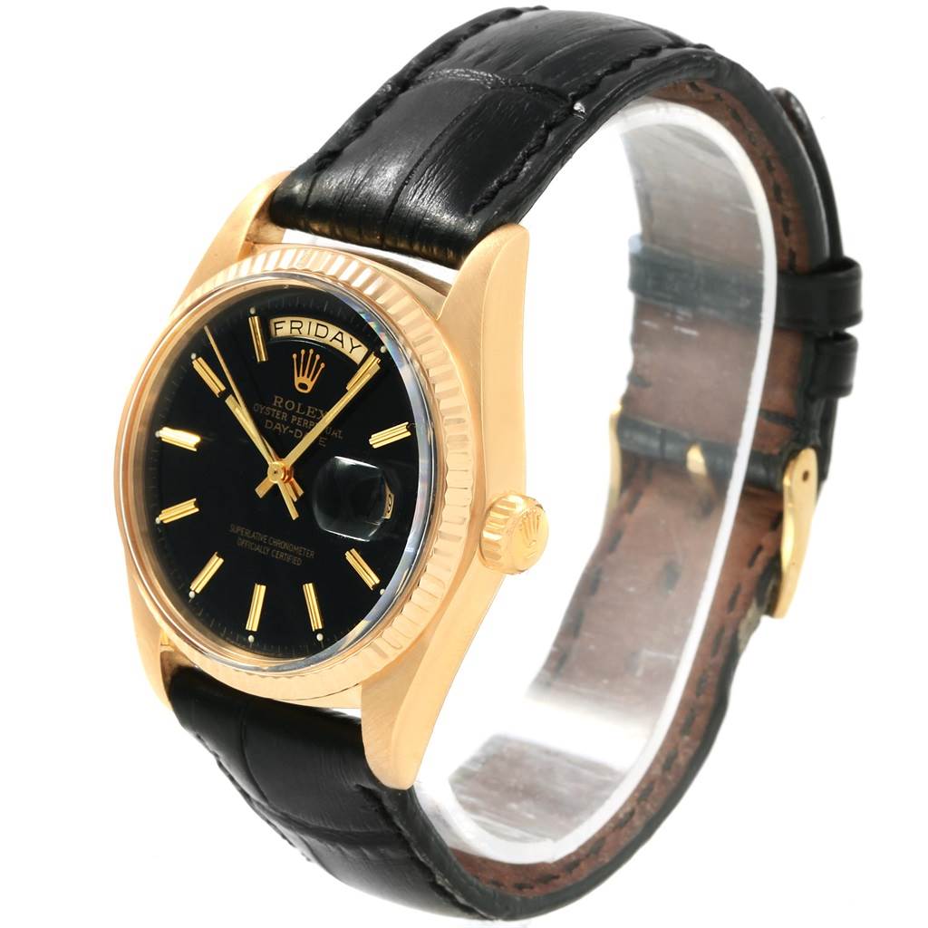 The Rolex President 1803 Men
s Yellow Gold Black Dial 1803 Men
s Yellow Gold Black Dial model watch is shown at a three-quarters angle, displaying the black dial, gold case, and black leather strap.