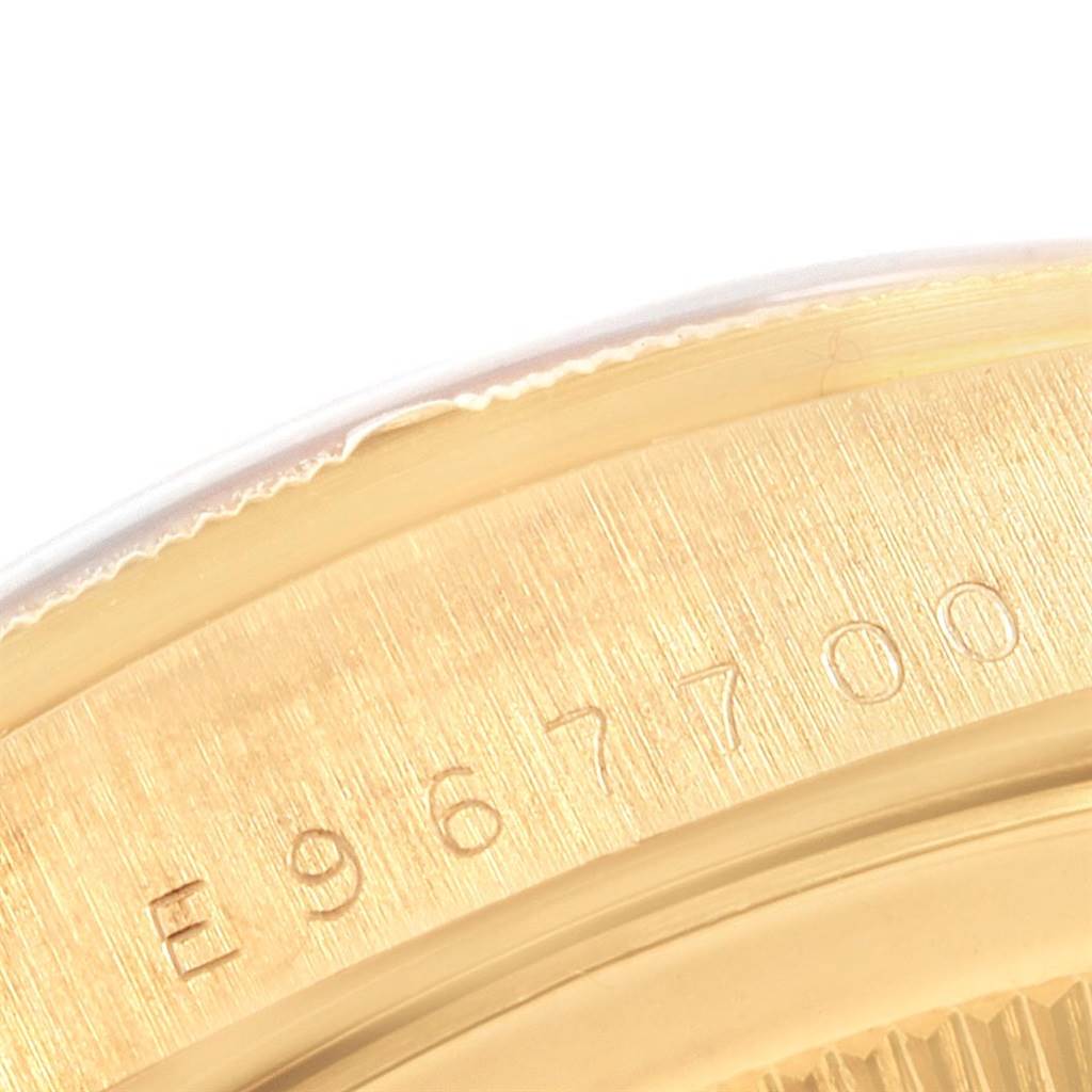 The image shows a close-up of the serial number engraving on the case of a Rolex President 20604 Men
s Yellow Gold Champagne Dial 20604 Men
s Yellow Gold Champagne Dial model watch.