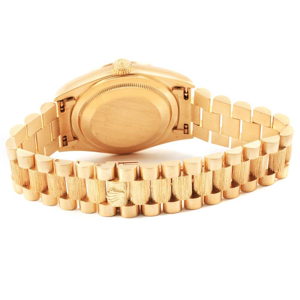 The image shows the back case and bracelet of a Rolex President 20604 Men
s Yellow Gold Champagne Dial 20604 Men
s Yellow Gold Champagne Dial model watch at a rear angle.
