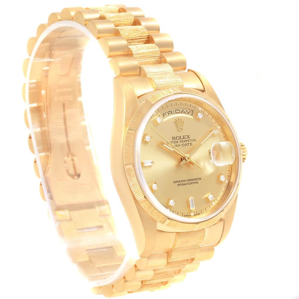 This image shows a Rolex President 20604 Men
s Yellow Gold Champagne Dial 20604 Men
s Yellow Gold Champagne Dial model watch from a front-left angle, highlighting the dial, day and date displays, and the bracelet.