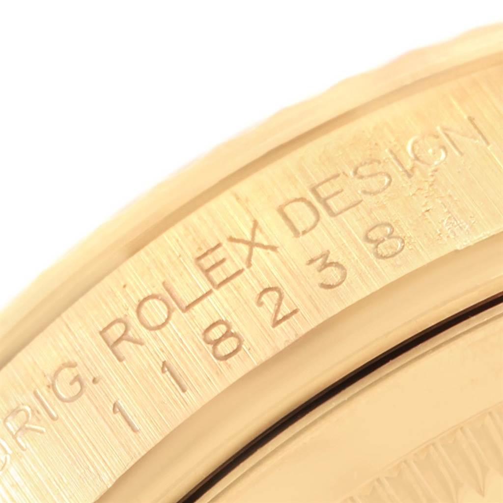The image shows a close-up of the case back rim with engravings on the Rolex President 118238 Men's Yellow Gold Black Dial 118238 Men's Yellow Gold Black Dial model watch.