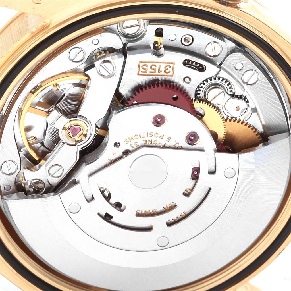 This is a close-up image of the internal mechanism of the Rolex President 118238 Men's Yellow Gold Black Dial 118238 Men's Yellow Gold Black Dial model watch, showing gears and various intricacies.