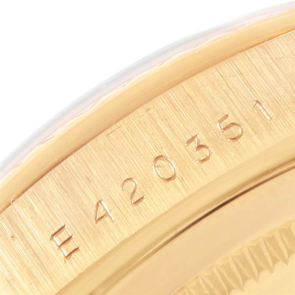 The image shows a close-up of the serial number engraving on the side of the Rolex President 18238 Men
s Yellow Gold Champagne Dial 18238 Men
s Yellow Gold Champagne Dial watch case.
