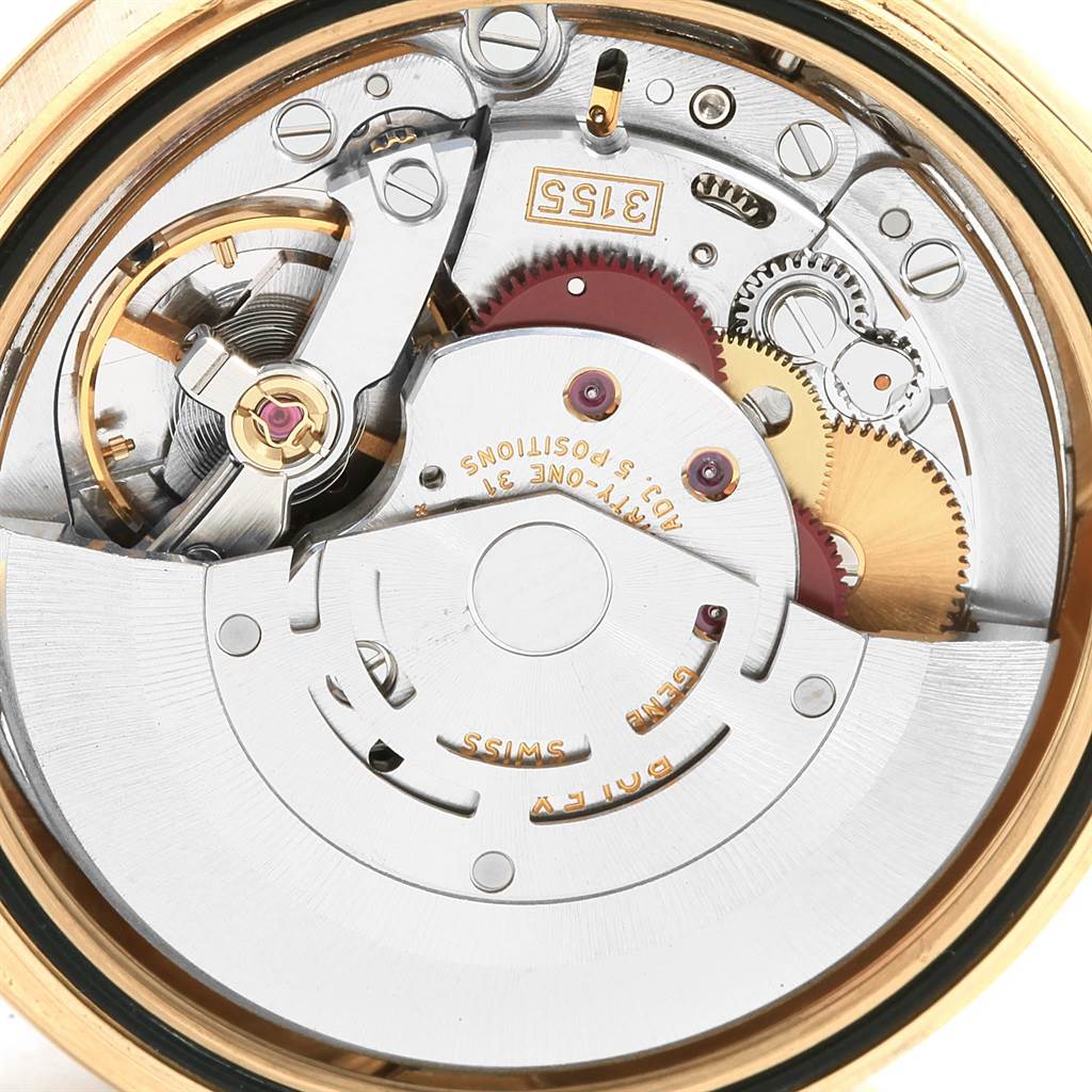This image shows the intricate internal movement of a Rolex President 118338 Men
s Yellow Gold Champagne Dial 118338 Men
s Yellow Gold Champagne Dial model watch from a close-up, top-down angle.