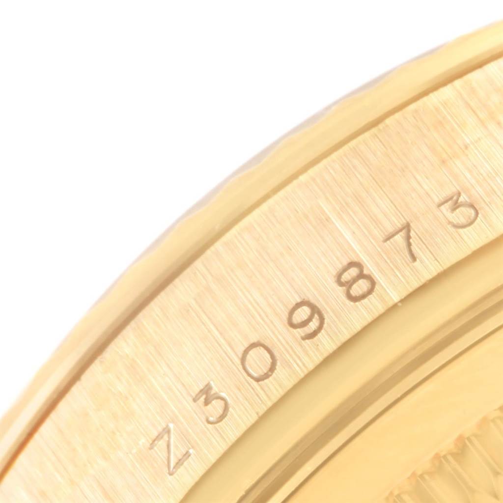 The image shows a close-up of the serial number engraving on the edge of a Rolex President 118338 Men
s Yellow Gold Champagne Dial 118338 Men
s Yellow Gold Champagne Dial model watch case.