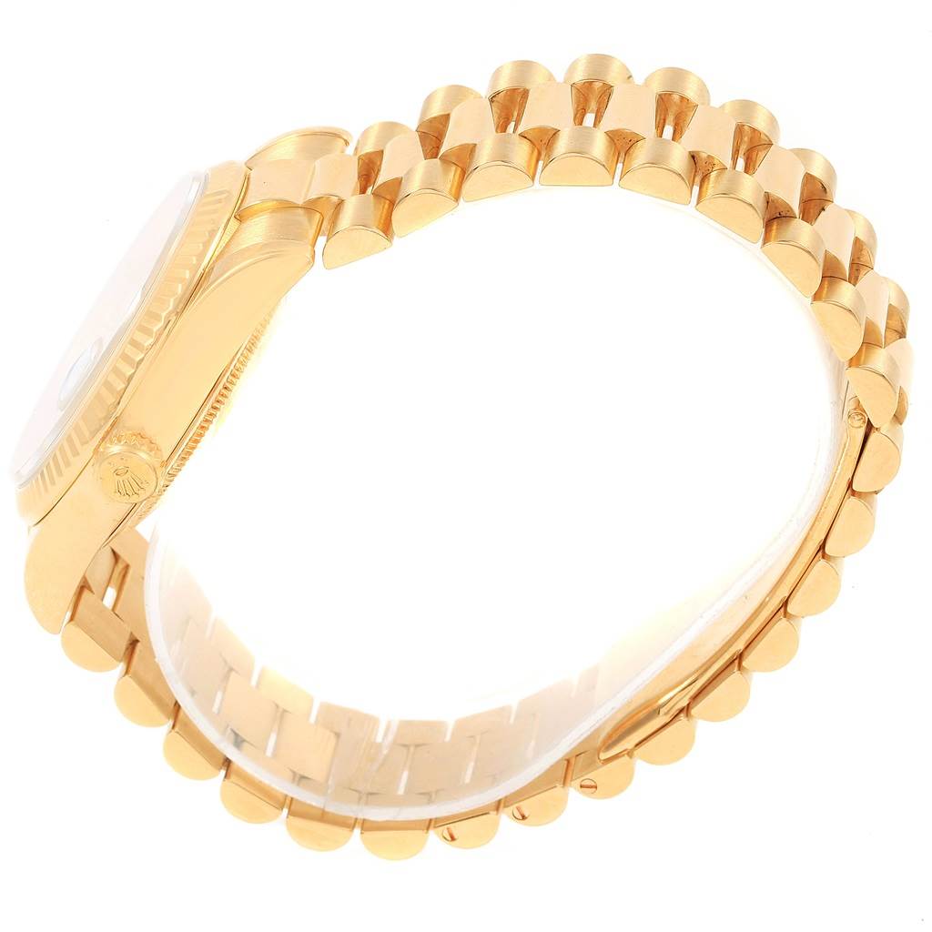 The image shows a side view of the Rolex President 118238 Men
s Yellow Gold White Dial 118238 Men
s Yellow Gold White Dial model, highlighting its gold case, crown, and bracelet.