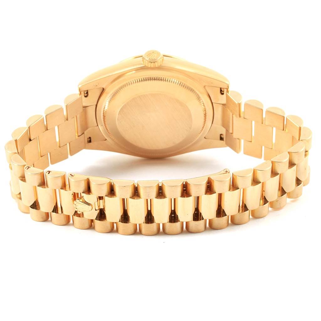 The image shows the back case and bracelet of a Rolex President 118238 Men
s Yellow Gold White Dial 118238 Men
s Yellow Gold White Dial model watch.