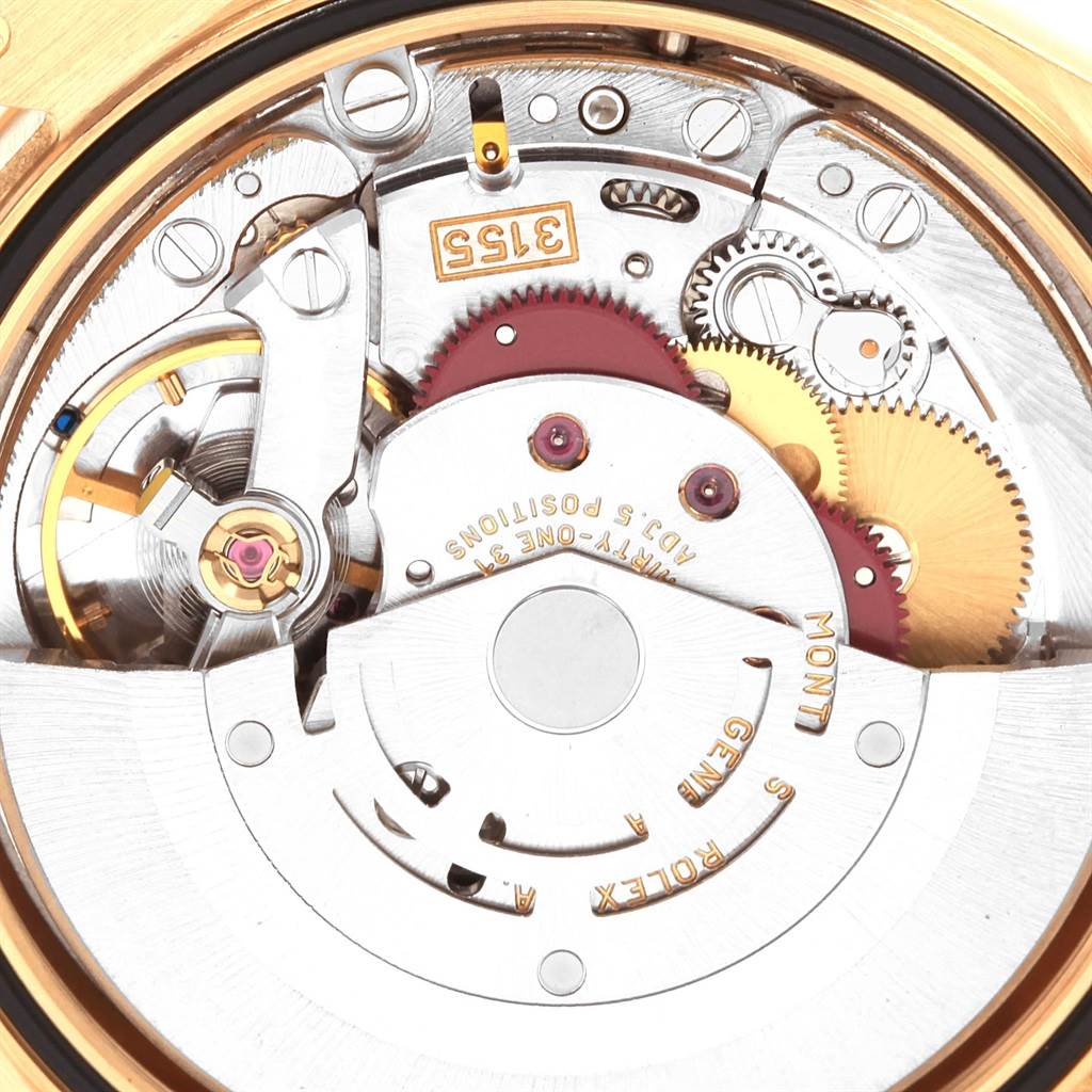 This close-up shows the mechanical movement components of the Rolex President 118238 Men
s Yellow Gold White Dial 118238 Men
s Yellow Gold White Dial model watch, including gears and the rotor.