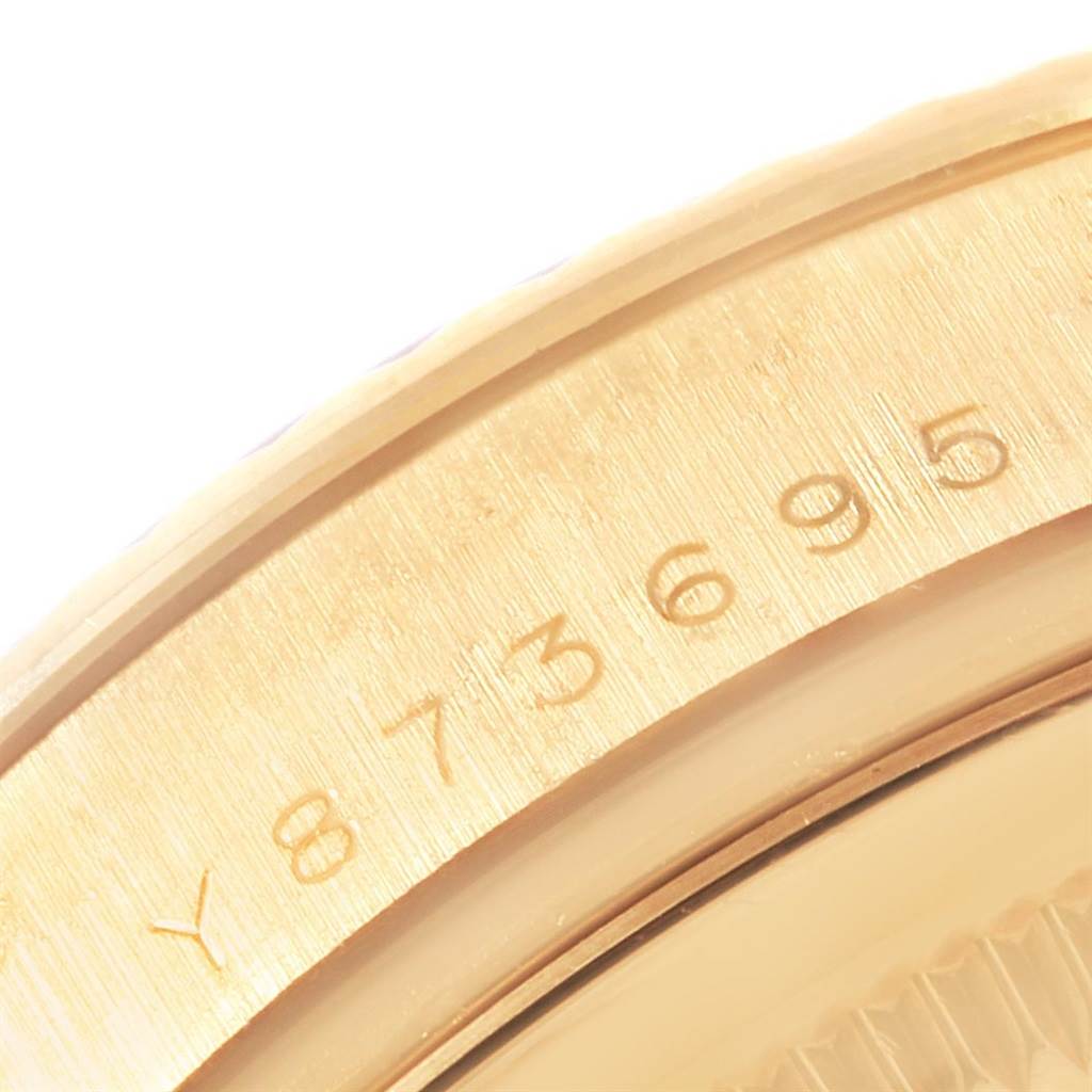 This image shows a close-up of the serial number engraving on the gold case of a Rolex President 118238 Men
s Yellow Gold White Dial 118238 Men
s Yellow Gold White Dial model watch.