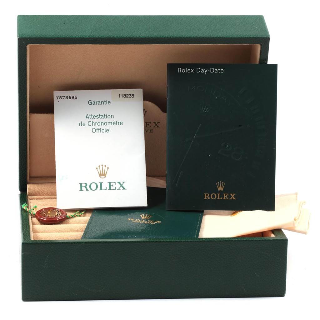 The image shows a storage box for a Rolex President 118238 Men
s Yellow Gold White Dial 118238 Men
s Yellow Gold White Dial model watch, along with documents and a booklet.