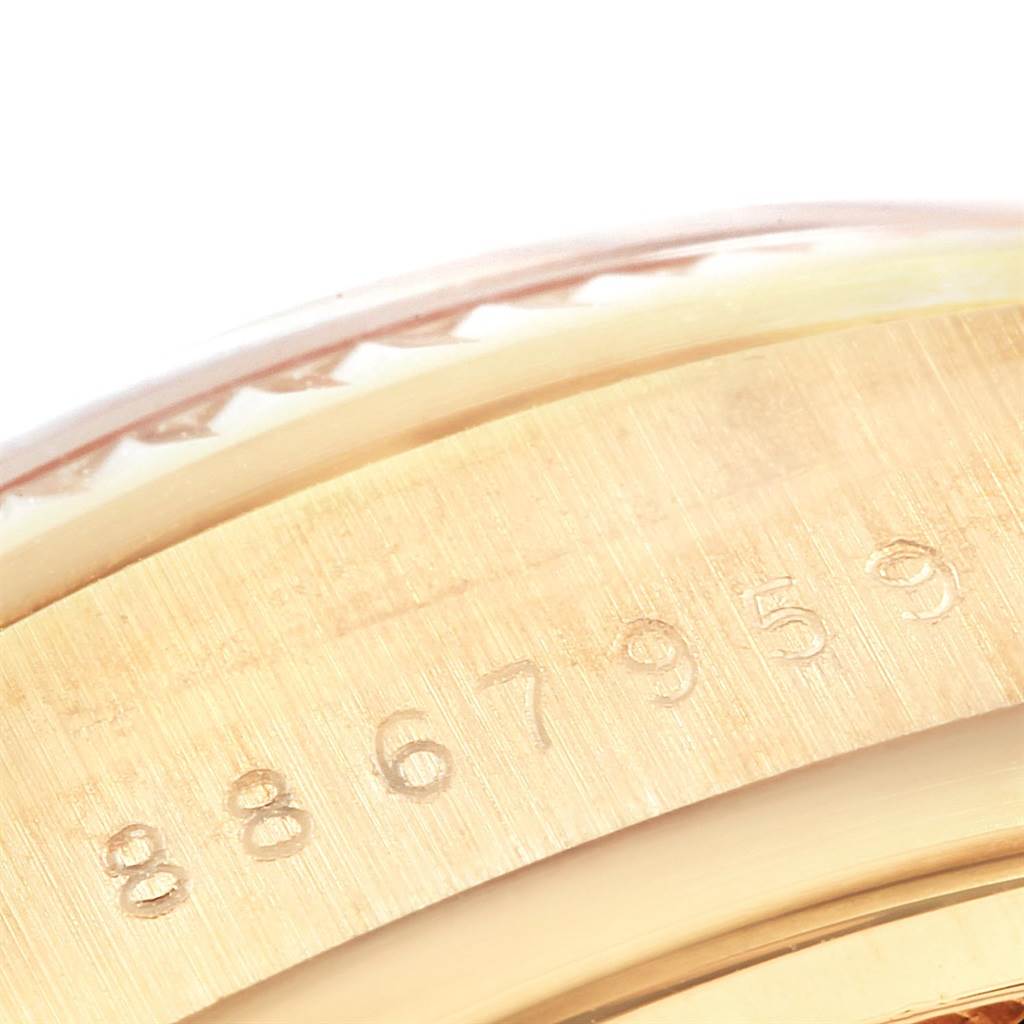 This close-up image shows the serial number engraving on the case of a Rolex President 18038 Men
s Yellow Gold Mother of Pearl Dial 18038 Men
s Yellow Gold Mother of Pearl Dial model watch.