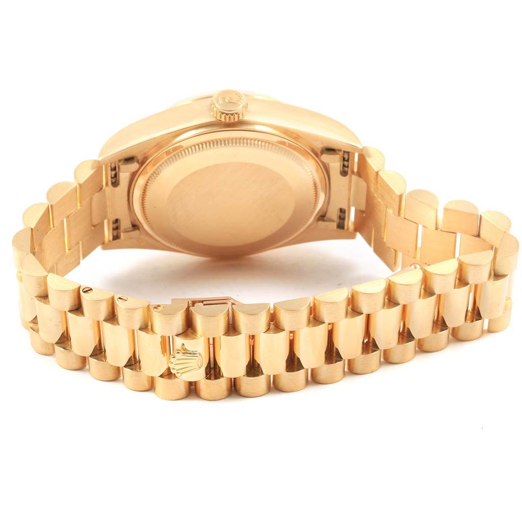 The image shows the back view of a Rolex President 18038 Men
s Yellow Gold Mother of Pearl Dial 18038 Men
s Yellow Gold Mother of Pearl Dial model watch, highlighting its case back and bracelet.