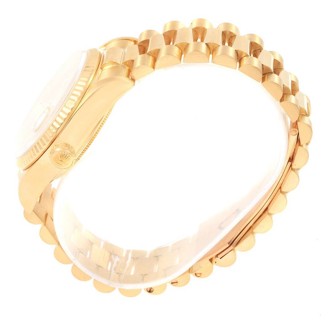 The image shows a side view of the Rolex President 18038 Men
s Yellow Gold Mother of Pearl Dial 18038 Men
s Yellow Gold Mother of Pearl Dial model, highlighting its gold case and bracelet.