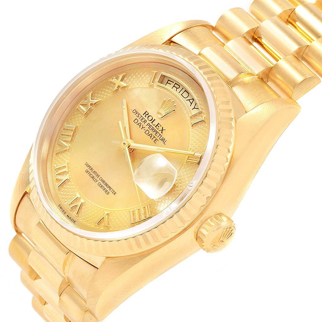 The image shows a Rolex President 18038 Men
s Yellow Gold Mother of Pearl Dial 18038 Men
s Yellow Gold Mother of Pearl Dial model watch in an angled close-up focusing on its dial, crown, and part of the bracelet.