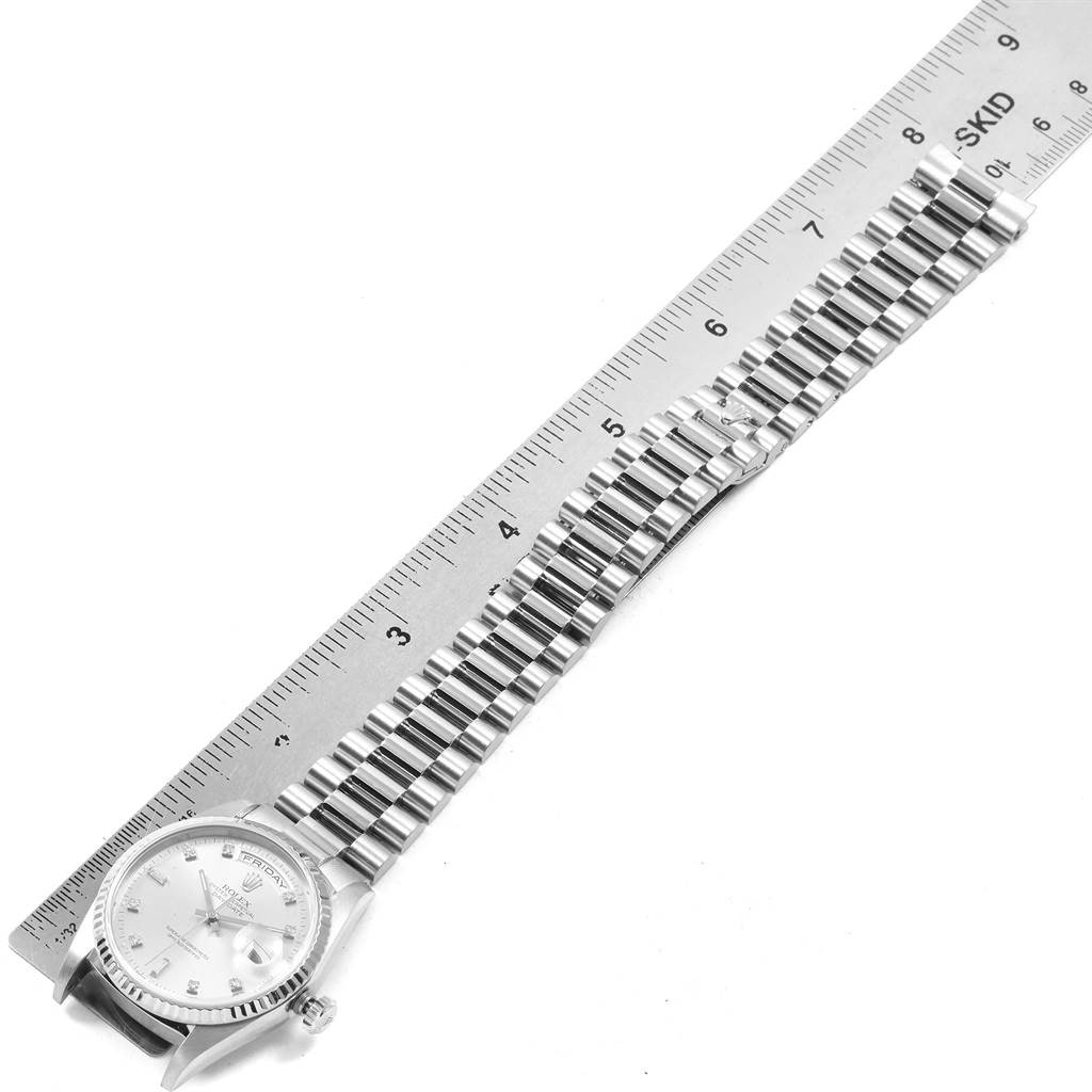 The image shows the full length of a Rolex President 18239 Men's White Gold Silver Dial 18239 Men's White Gold Silver Dial model watch placed beside a ruler for measurement.