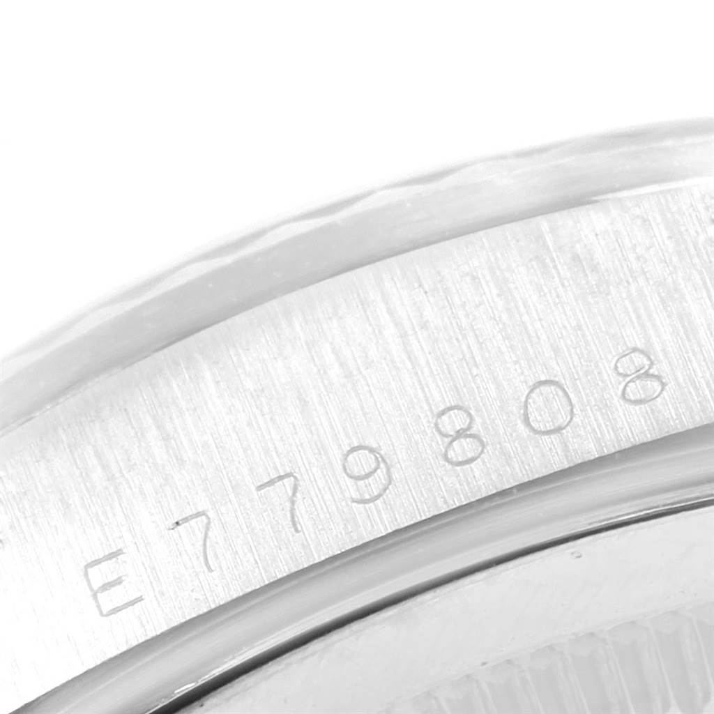 This image shows a close-up of the serial number engraving on the side of a Rolex President 18239 Men's White Gold Silver Dial 18239 Men's White Gold Silver Dial model watch.