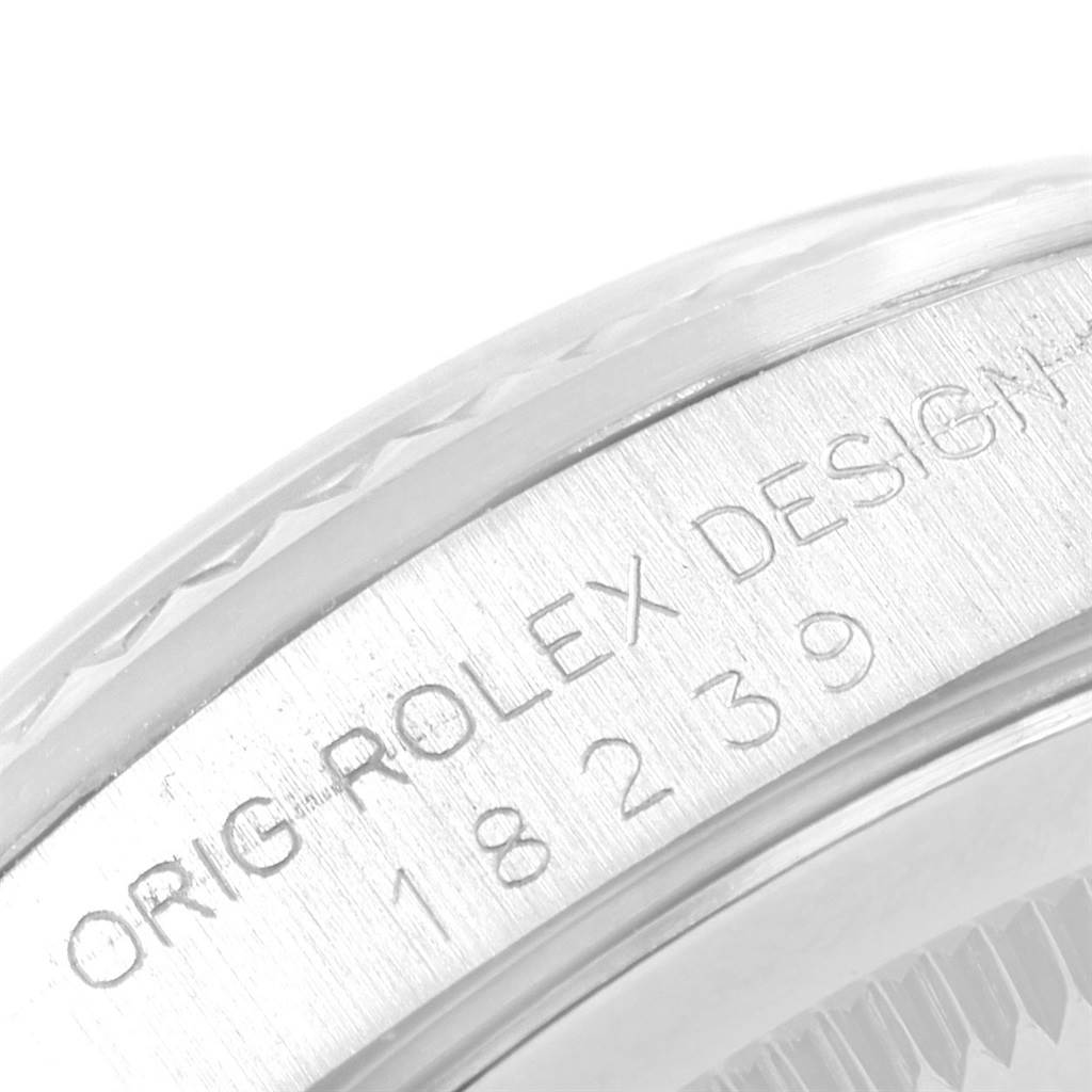 This image shows a close-up of the side engraving on the bezel of a Rolex President 18239 Men's White Gold Silver Dial 18239 Men's White Gold Silver Dial model watch.