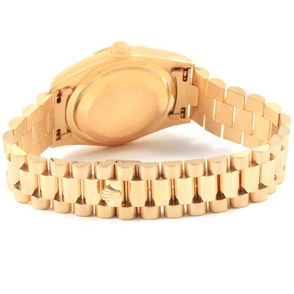 This image shows the back case and bracelet of a Rolex President 18238 Men
s Yellow Gold White Dial 18238 Men
s Yellow Gold White Dial model watch at an angle.
