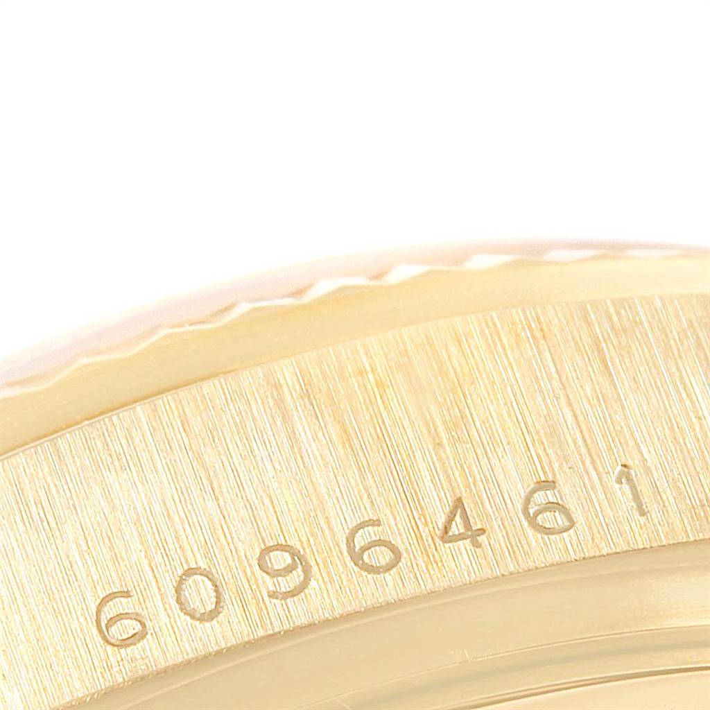 The image shows a close-up of the side of a Rolex President 18038 Men's Yellow Gold Silver Dial 18038 Men's Yellow Gold Silver Dial model, focusing on the engraved serial number.