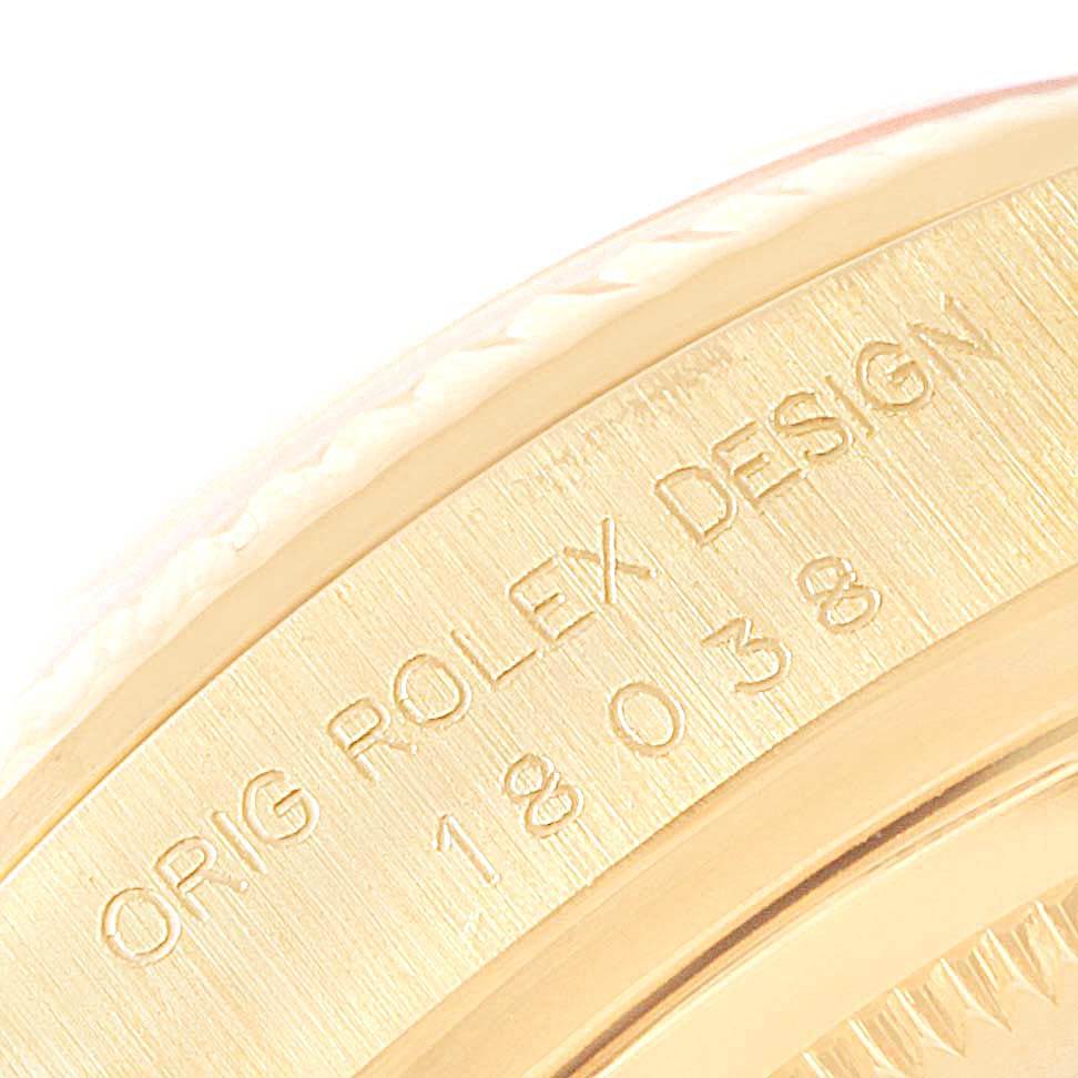 The close-up image shows the engraved case side of a Rolex President 18038 Men's Yellow Gold Silver Dial 18038 Men's Yellow Gold Silver Dial model watch.