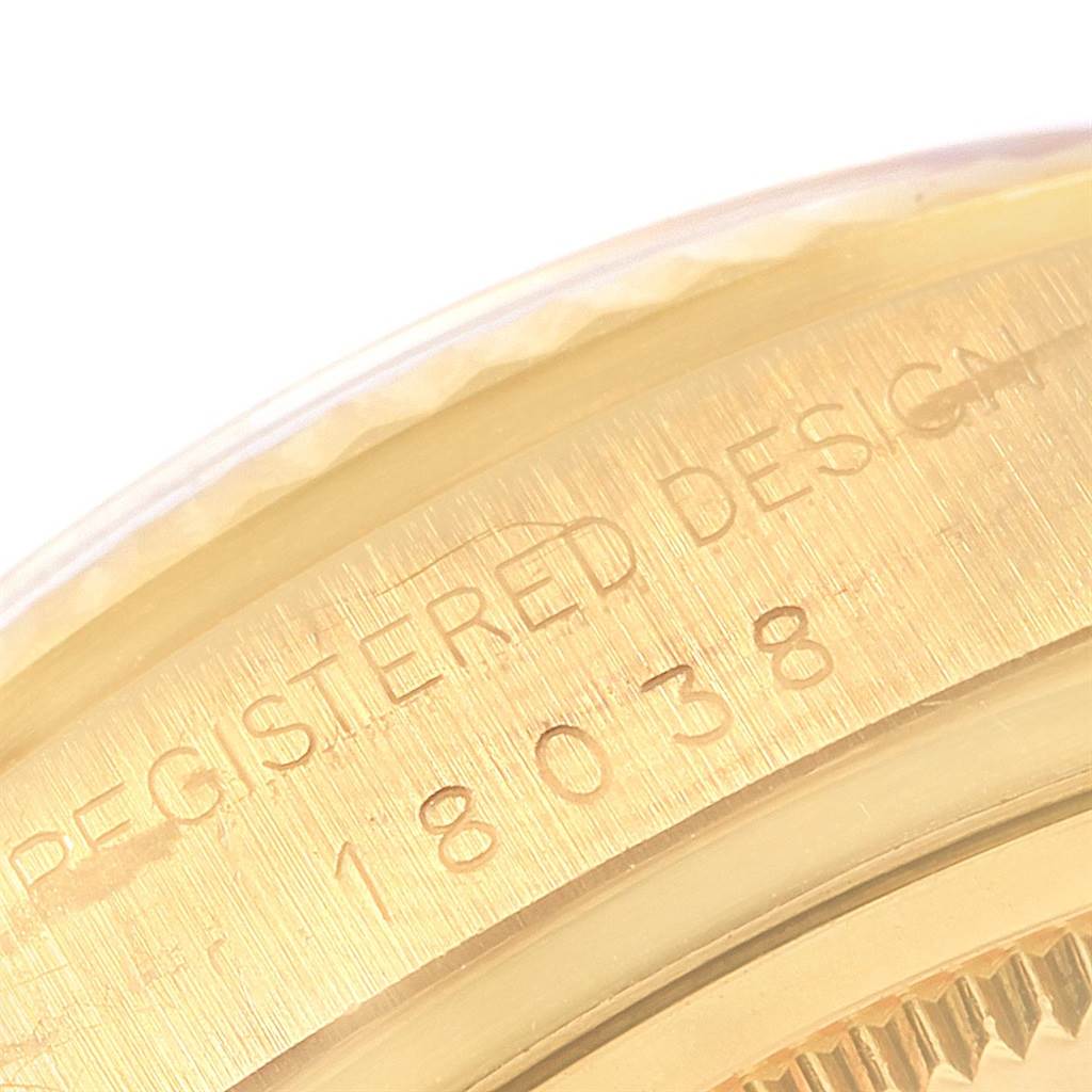 The image shows a close-up of the engraved caseback of a Rolex President 18038 Men
s Yellow Gold Champagne Dial 18038 Men
s Yellow Gold Champagne Dial model watch, angle highlighting the serial number.