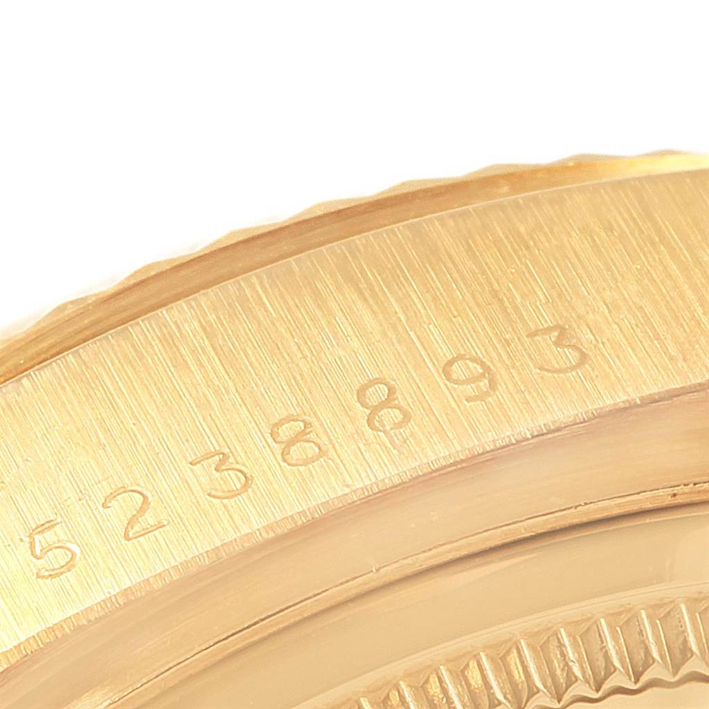 A close-up of the bezel and edge of the case with serial numbers of a Rolex President 18038 Men
s Yellow Gold Champagne Dial 18038 Men
s Yellow Gold Champagne Dial model watch.