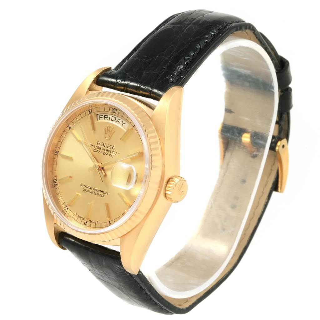 This image shows a Rolex President 18038 Men
s Yellow Gold Champagne Dial 18038 Men
s Yellow Gold Champagne Dial Day-Date watch at a slight angle from the front, displaying its dial, case, crown, and strap.