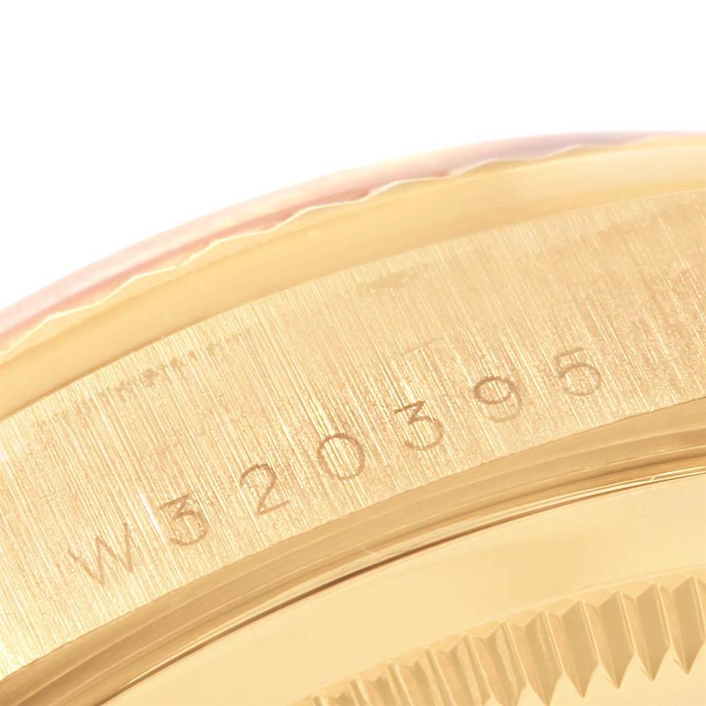 The image shows a close-up of the case with the serial number of a Rolex President 18238 Men
s Yellow Gold Champagne Dial 18238 Men
s Yellow Gold Champagne Dial model watch.