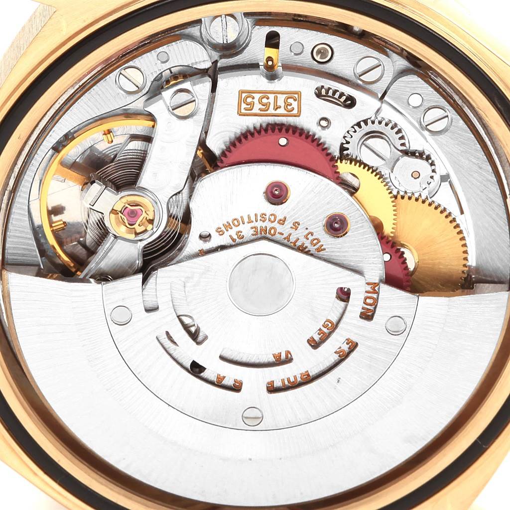 This image shows the internal movement components of a Rolex President 18238 Men
s Yellow Gold Champagne Dial 18238 Men
s Yellow Gold Champagne Dial model watch taken from a close-up, back view angle.
