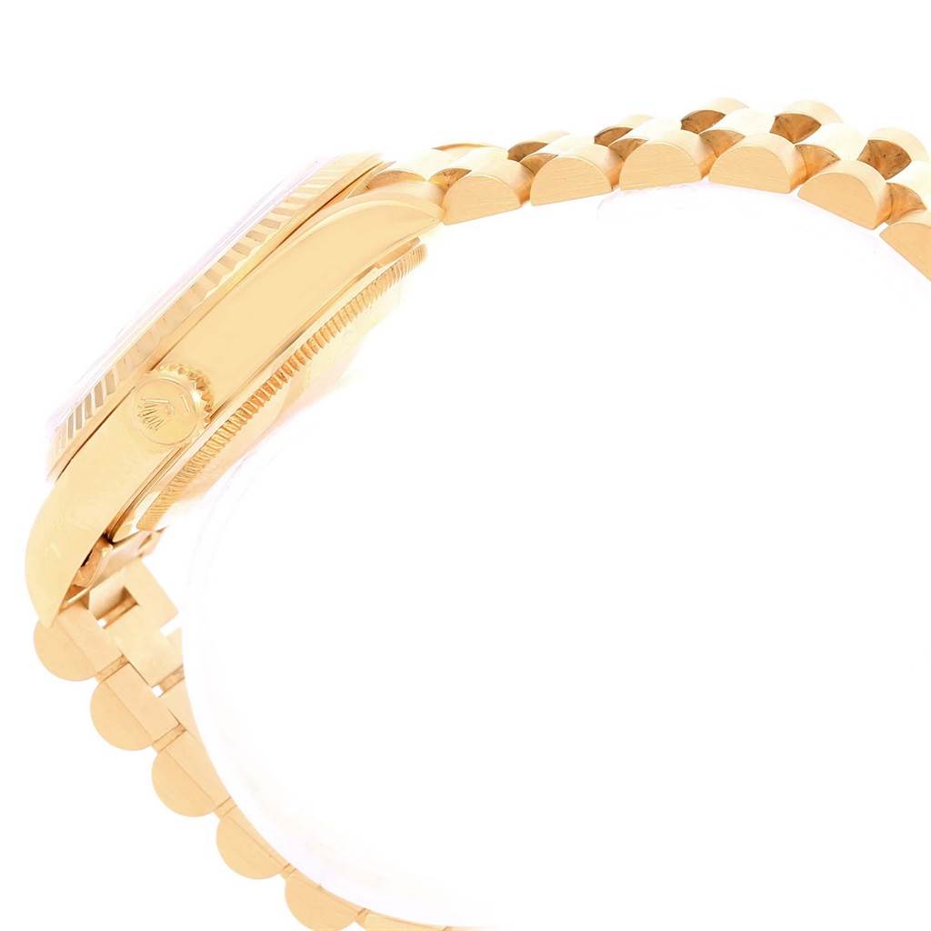 This side view of the Rolex President 18238 Men
s Yellow Gold Champagne Dial 18238 Men
s Yellow Gold Champagne Dial watch shows the case, crown, and part of the bracelet.