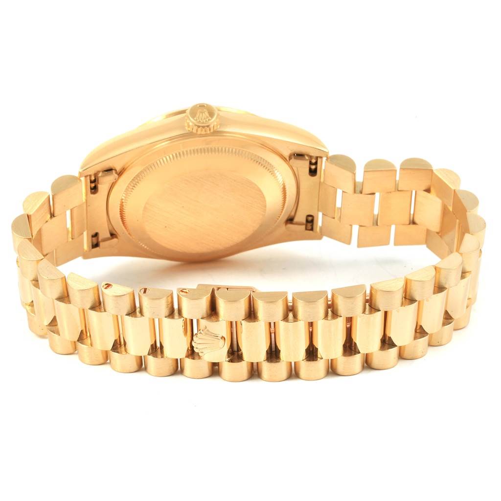 This image shows the back and bracelet of a Rolex President 18238 Men
s Yellow Gold Champagne Dial 18238 Men
s Yellow Gold Champagne Dial model watch at an angled view.