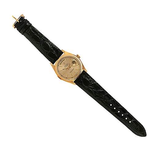 This Rolex President 18038 Men's Yellow Gold Silver Dial 18038 Men's Yellow Gold Silver Dial model watch is shown from a top-down angle, displaying its face and black leather strap.