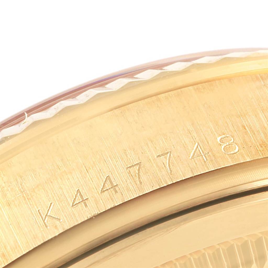 This image shows a close-up view of the case back and serial number of a Rolex President 118238 Men's Yellow Gold Silver Dial 118238 Men's Yellow Gold Silver Dial model watch.