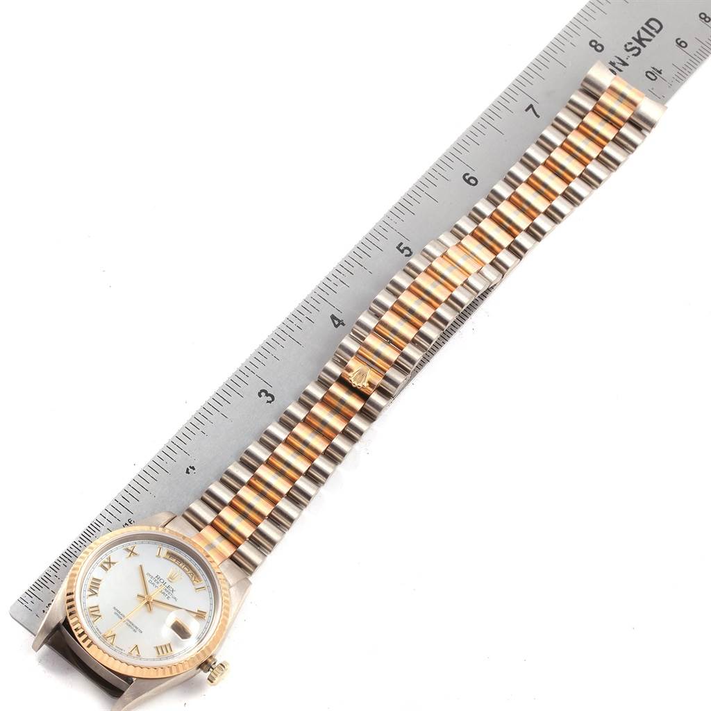 The Rolex President 18239 Men
s White Gold Mother of Pearl Dial 18239 Men
s White Gold Mother of Pearl Dial model watch is shown from a top-down angle, featuring its face, bezel, and bracelet alongside a ruler for measurement.