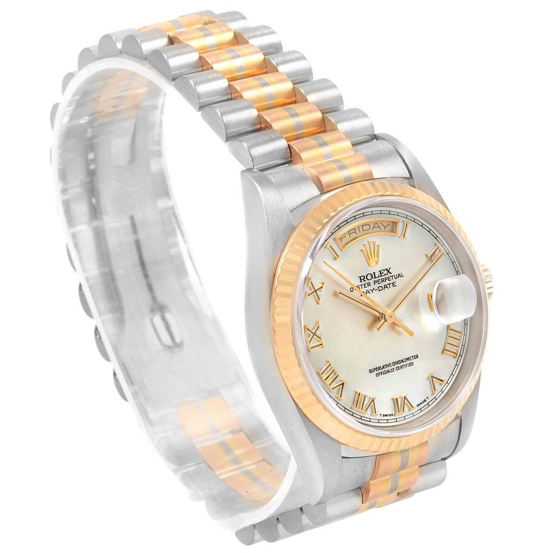 This image shows a side angle of a Rolex President watch, highlighting its face, bezel, and two-tone bracelet.