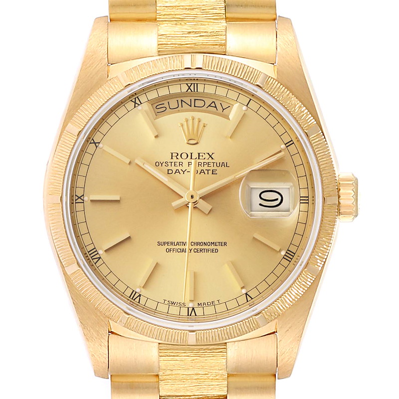 The image shows a close-up of the dial and bezel of the gold Rolex President Oyster Perpetual Day-Date watch.