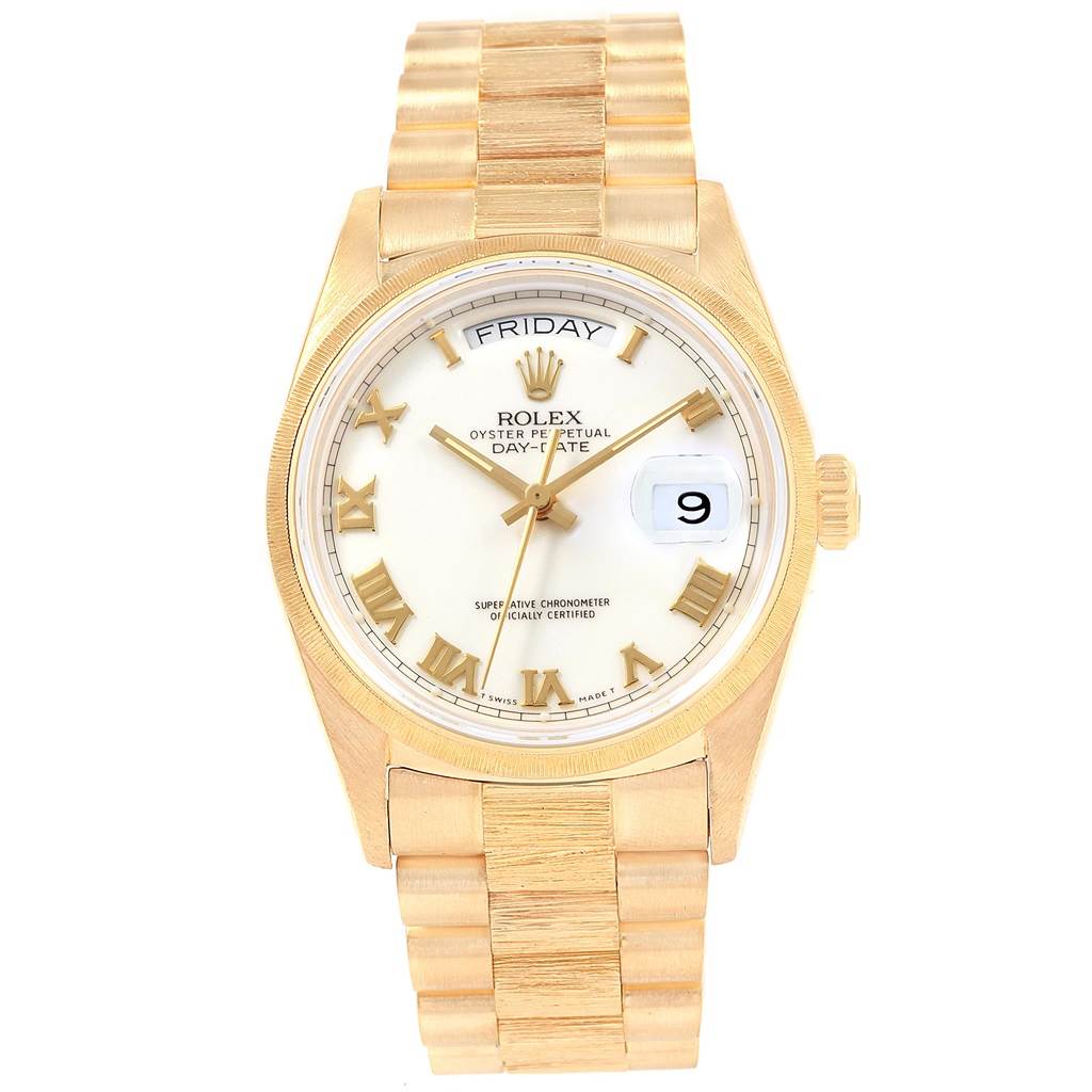 This image shows the front view of a Rolex President 18078 Men's Yellow Gold White Dial 18078 Men's Yellow Gold White Dial model watch, displaying the dial, day, date, and bracelet.