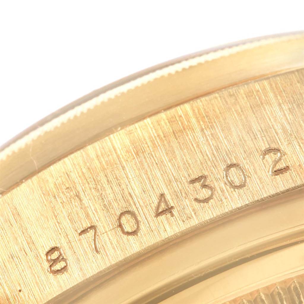 The image shows a close-up of the serial number engraved on the case back of a Rolex President 18078 Men's Yellow Gold White Dial 18078 Men's Yellow Gold White Dial model watch.