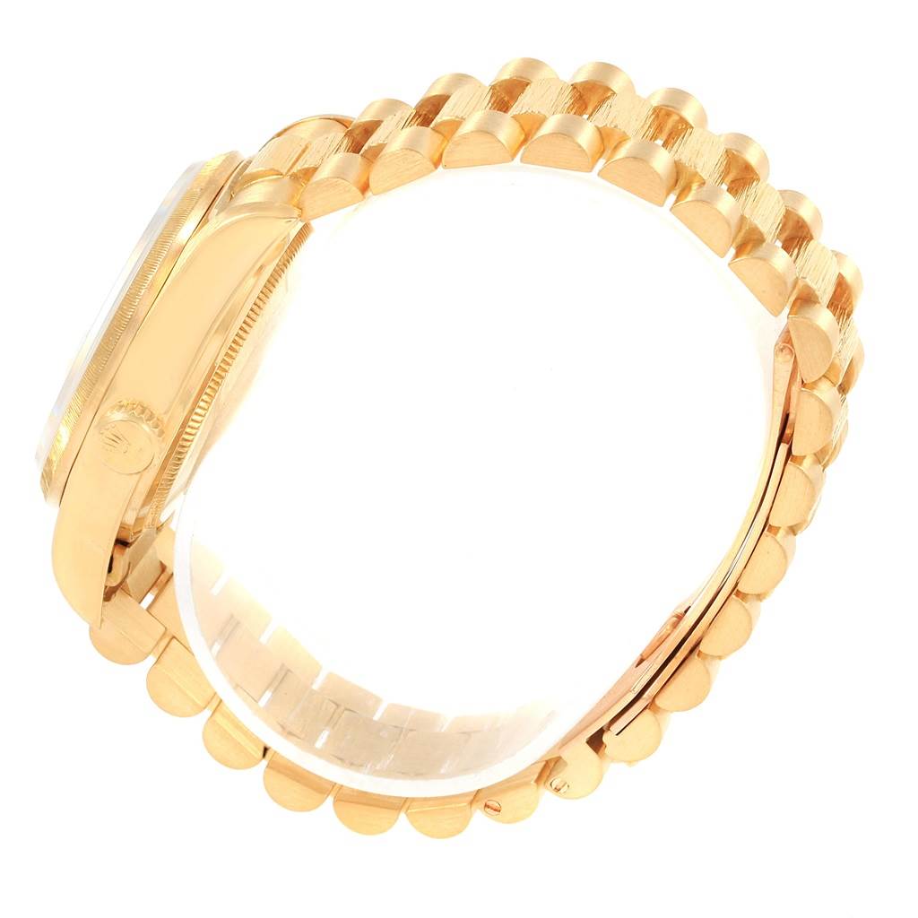 The image shows a side view of a Rolex President 18078 Men's Yellow Gold White Dial 18078 Men's Yellow Gold White Dial model watch, highlighting its gold case and bracelet.