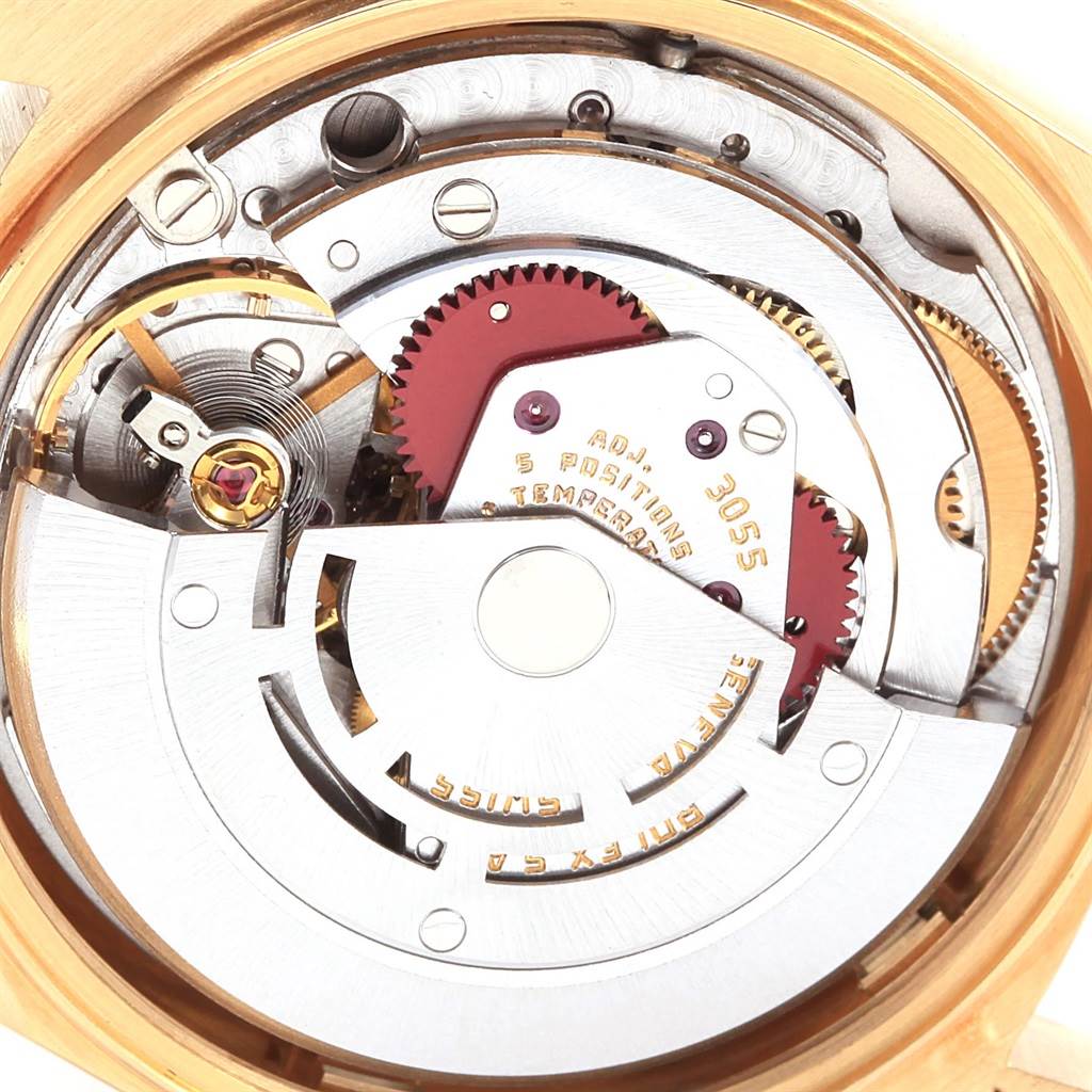 This image shows the intricate internal mechanism of a Rolex President 18078 Men's Yellow Gold White Dial 18078 Men's Yellow Gold White Dial model watch from a close-up, angled view.