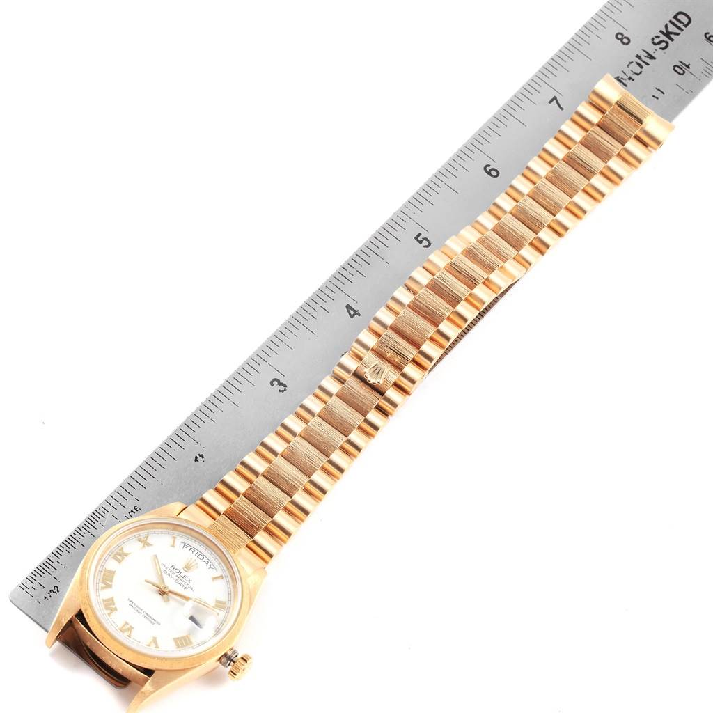 The image shows a Rolex President 18078 Men's Yellow Gold White Dial 18078 Men's Yellow Gold White Dial model watch laying flat with the strap extended and a ruler beside for measurement.