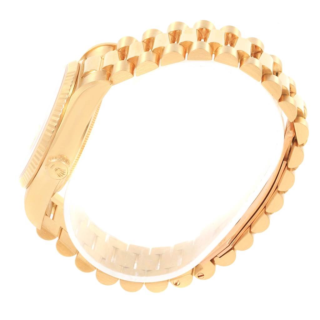 The image shows a side view of the Rolex President 18038 Men
s Yellow Gold Champagne Dial 18038 Men
s Yellow Gold Champagne Dial watch, highlighting the gold case and bracelet.