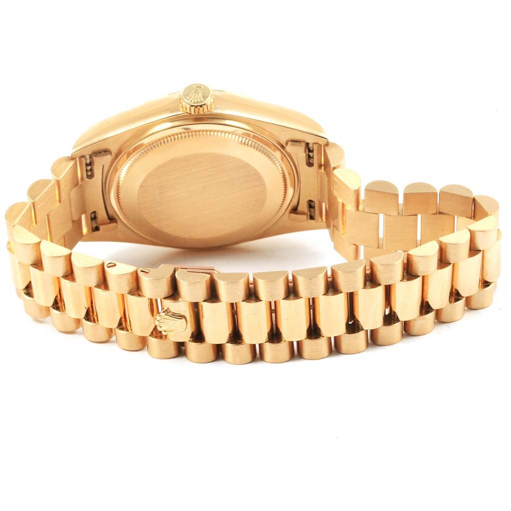 The image shows the back and bracelet of the Rolex President 18038 Men
s Yellow Gold Champagne Dial 18038 Men
s Yellow Gold Champagne Dial model watch, highlighting its clasp and links.