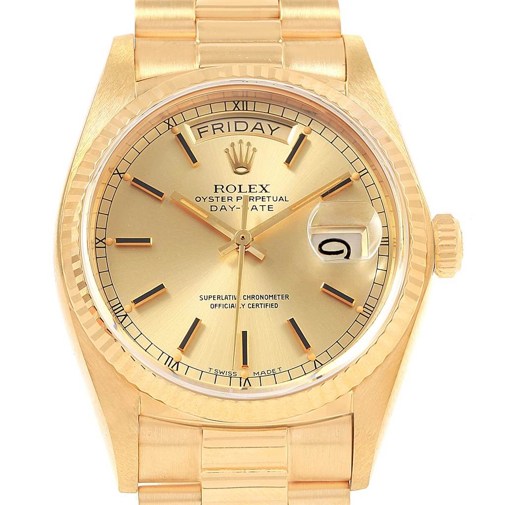 The Rolex President 18038 Men
s Yellow Gold Champagne Dial 18038 Men
s Yellow Gold Champagne Dial model watch shown from a top-down angle displays the gold dial, day, date, and President bracelet.
