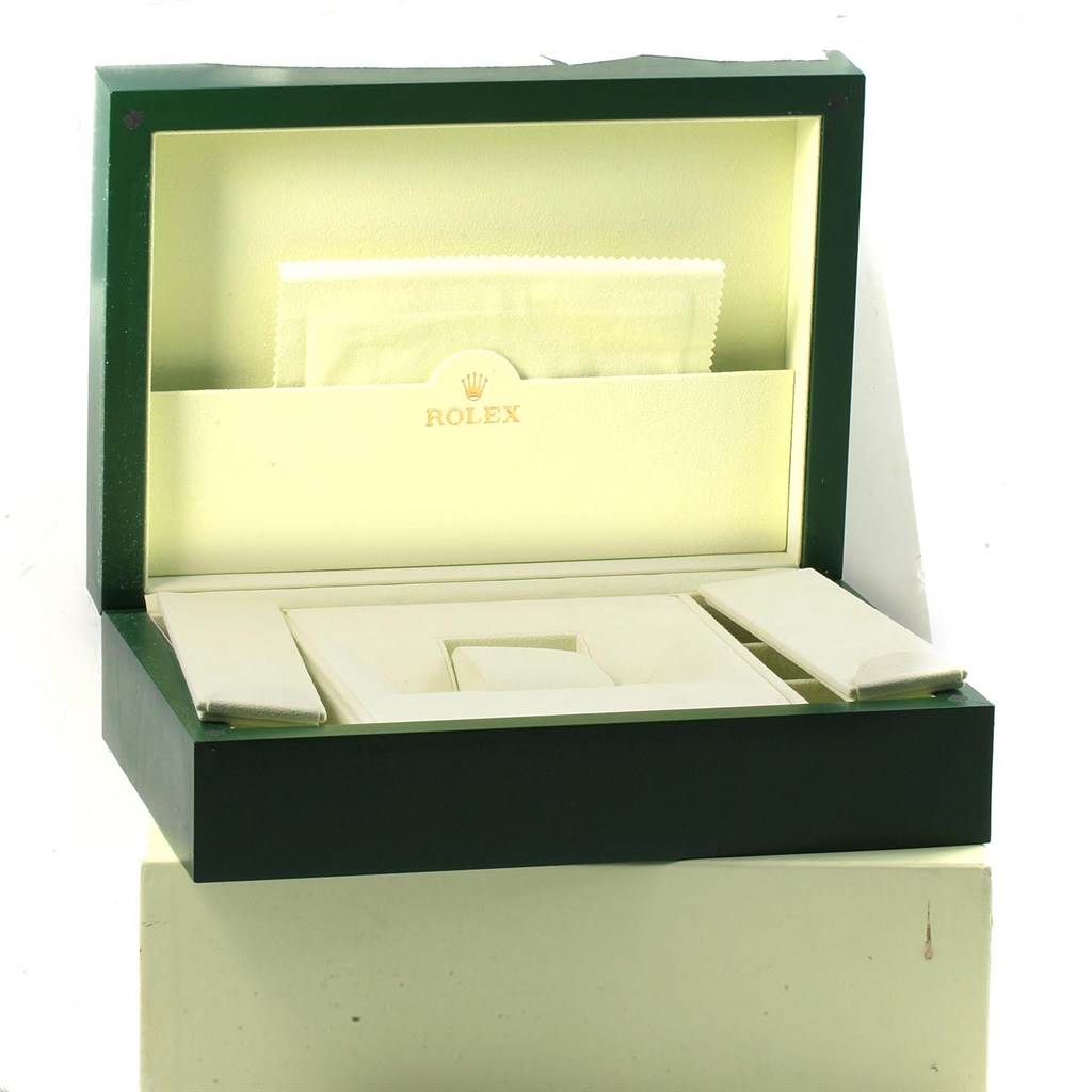 An open Rolex President 18138 Men
s Yellow Gold Champagne Dial 18138 Men
s Yellow Gold Champagne Dial watch box displaying an inner compartment and storage sections, viewed from a slightly angled perspective.